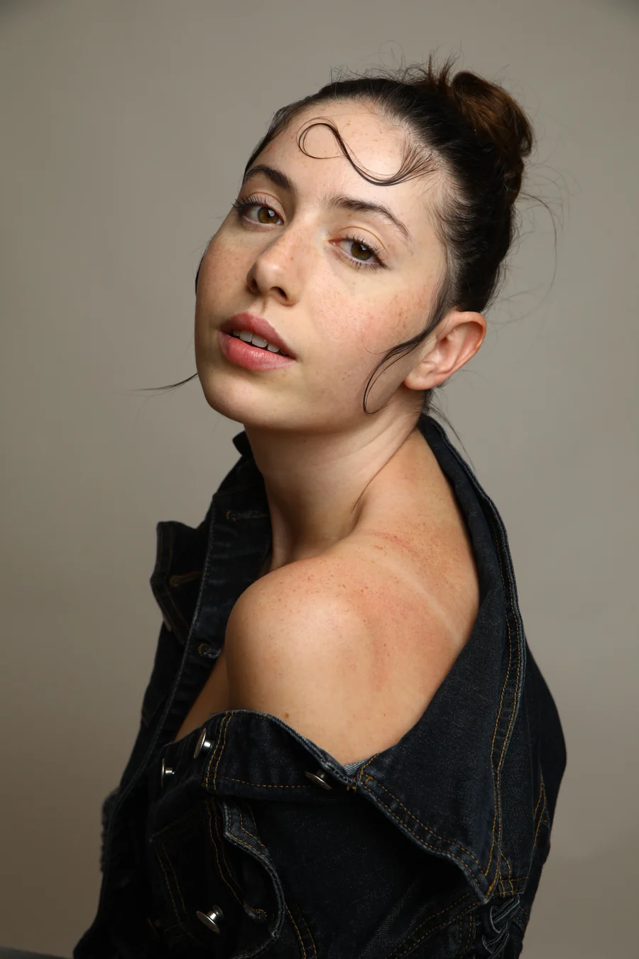 Portrait over the shoulder in a denim jacket